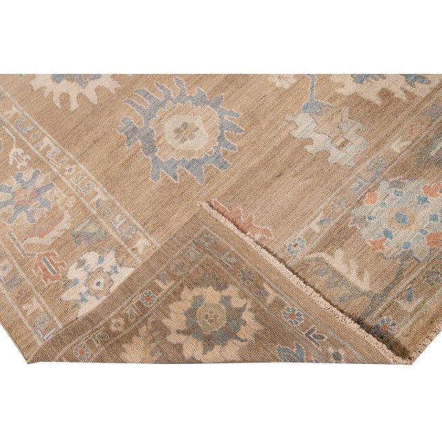 Beautiful modern Sultanabad hand-knotted wool rug with a brown field. This Sultanabad rug has a multi-color accent in a...