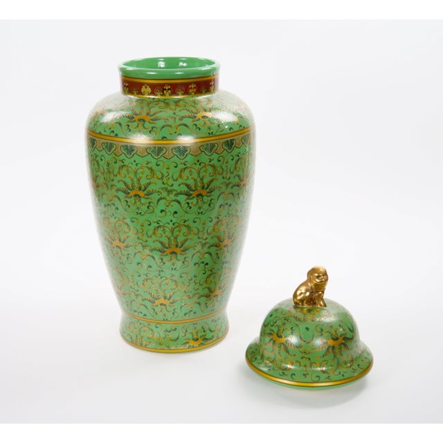 An impressive large Chinese Export enameled decorative urn, dating to the late 20th century, distinguished by its...