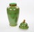 An impressive large Chinese Export enameled decorative urn, dating to the late 20th century, distinguished by its...