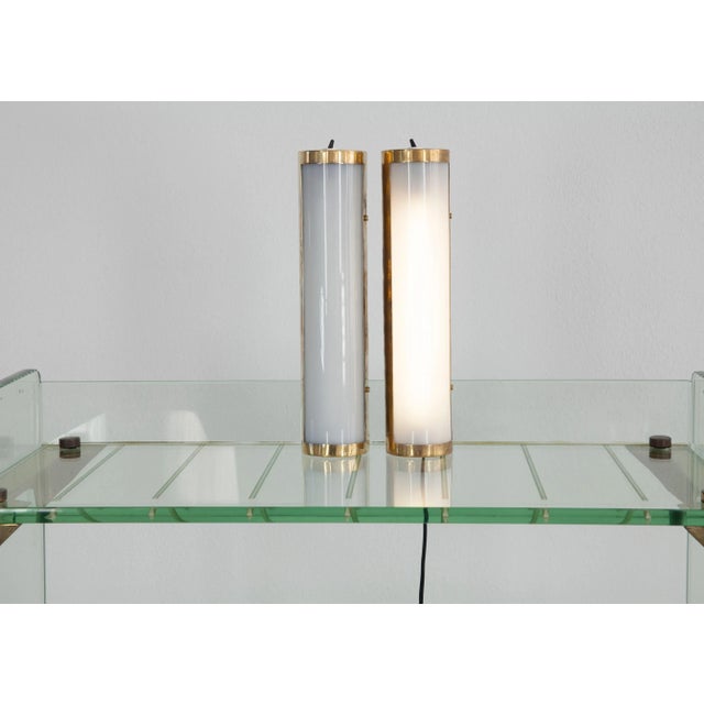 Liseuse wall lamps from Japan from the 70s. Structure in brass, iron and acrylic. Neon tube. Switch on and off with the...