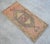 an Vintage small rug. Medium wood background color yastik rug perfect for a small guest bath or in front of the kitchen...