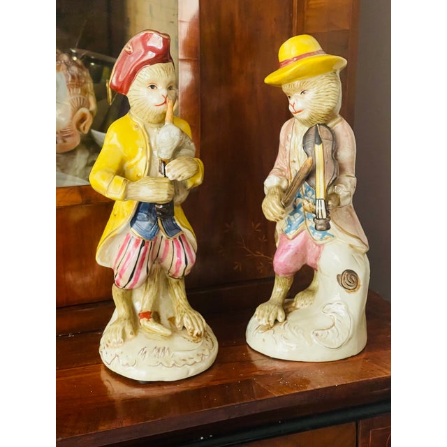 Whimsical pair of vintage ceramic sculptures figurines of musician monkeys.