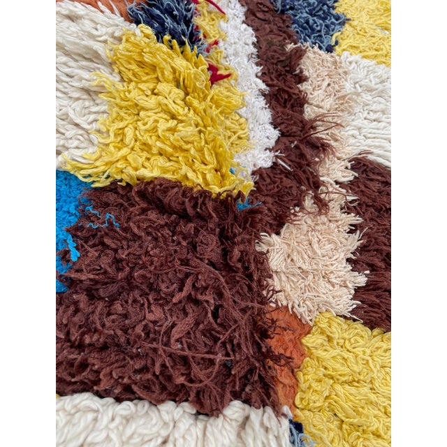 Hand-woven by the Berber women in the Atlas Mountains, this Vintage rug is created with soft natural wool fibers from the...