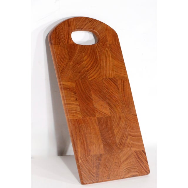 Mid Century Danish modern teak cutting board designed. by Jens Quistgaard for Dansk. The cutting board is in good...