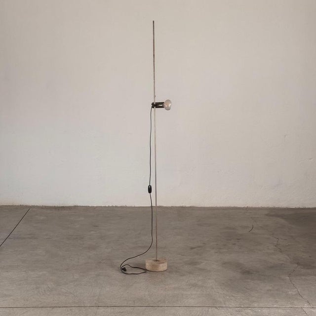 A true masterpiece of mid-century italian lighting design, the model 387 floor lamp, designed by tito agnoli in 1954,...