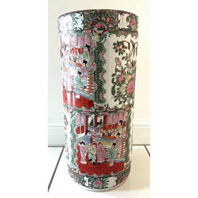 Rose Canton umbrella stand highlighted with gold rim and gilt hand painted throughout, peacocks, butterflies and flowers....