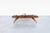 Vintage sculptural walnut coffee table, United States, circa 1960s. Defined by its flowing silhouette and organic lines,...
