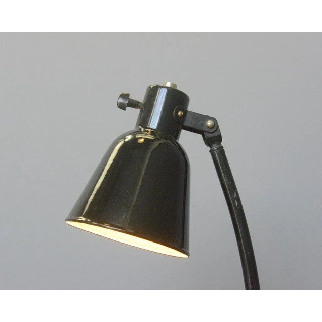 - Vitreous black enamel shade - Adjustable arm and shade - Cast iron base - Takes E27 fitting bulbs - Original bulb holder...