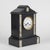 Temple clock in black marble with engraved decorations and white veined gray side bands, enamelled metal dial with roman...