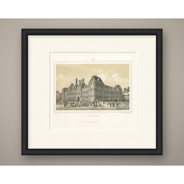 A broad, sunlit tinted lithograph of the hotel de ville, the city hall of paris, seen at an angle across its cobbled...