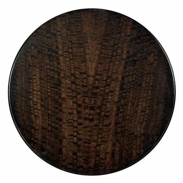 Sleek metropolitan styling is evident with this fine table for drinks. A round top is veneered with rich figured...