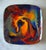 Vintage copper enamel square plate with vibrant swirls of gold, purple, orange, red, and turquoise with a black enamel...
