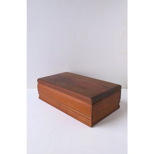 A velvet lined wood jewelry box. Ample room and easy open/close lid. Desk or vanity tray, cat's eye egg, and letter opener...