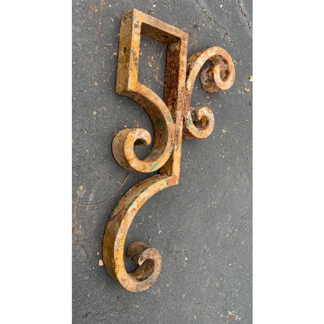 This large antique cast iron corbel bracket is a stunning piece of architectural salvage that would make a great addition...