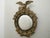 An English silver gilt convex girandole bullseye mirror from the early 20th century, with eagle motif. Created in England...