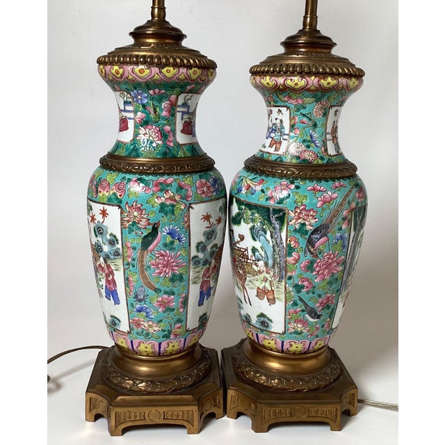 A remarkable pair of early 19th century hand painted Rose Mandarin Chinese Export porcelain vases now as lamps. The vases...
