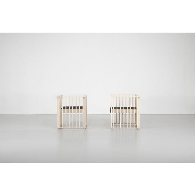 Pair of "Purkersdorf" armchairs in solid white lacquered beech with black woven webbing seats (new webbing). Designed by...