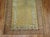 Late 19th century angora wool Turkish Oushak. The field is a soft yellow. The border is a melon color. Measures: 4' x 5'9".