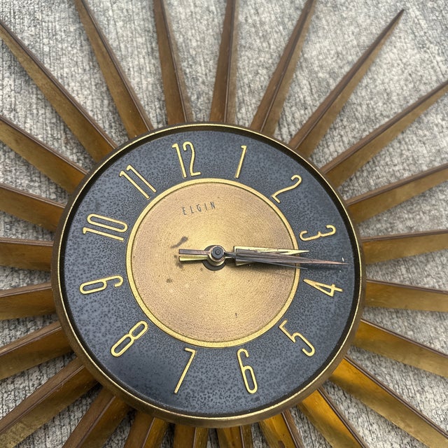 Up for consideration is a beautiful vintage Elgin starburst/sunburst brass wall clock. This would look lovely in your...