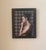 The artwork features a contemplative figure, captured in profile with a thoughtful expression, emphasizing a moment of...