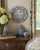 A charming vintage Italian decorative plate from Faenza, hand painted in a traditional palette of cobalt blue, leafy...