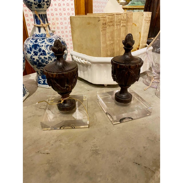 19th Century French wood finials mounted on lucite bases. Circa 1880