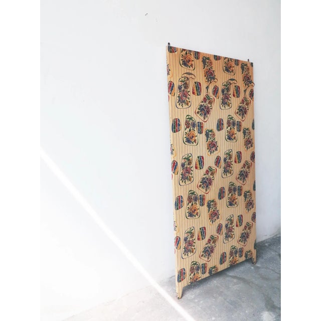 50s garment panel with 4 brass hooks and floral vinyl covering, original of the time.