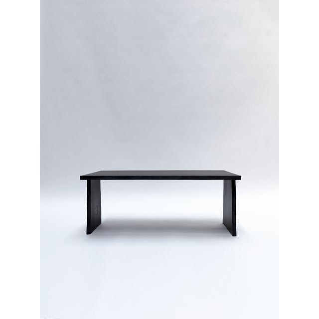 Crafted from ancient 5.550 years old Bog Oak, this table embodies the depth and character of timber preserved underground...