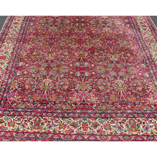 Measures: 9' x 12'. Antique Persian Lavar Kerman Rug with All-Over Floral Design In Jewel Tones. Keivan Woven Arts / rug...