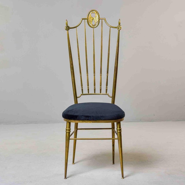 In the tradition of Italian Chiavari craftsmanship, this tall brass side chair features a high spindle back crowned by a...