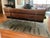 Original 1984 Charles and Ray Eames 3 seat sofa. Walnut, gunstock oil finish and black leather. Aluminum polished legs and...