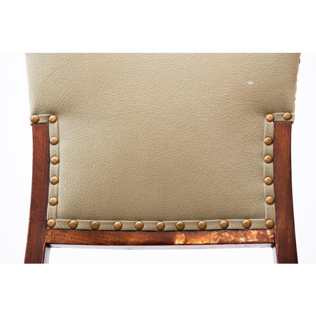 Original Art Nouveau dining armchairs around 1910 with two brass feet each on the front legs, in good used condition. They...