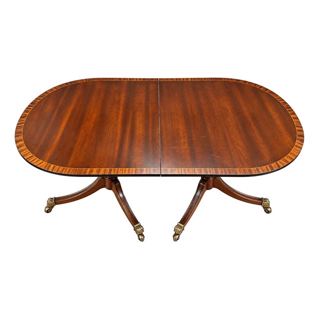 Large English Extendable Mahogany Table with Brass Claw Legs, 1890s For Sale