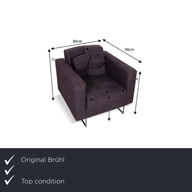 The Embrace armchair from Brühl impresses with its geometric, slim design. It is covered in a purple fabric and stands on...