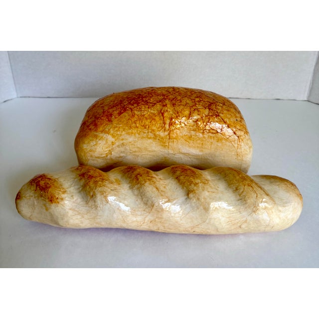 Bring a touch of playful charm to your kitchen, pantry, or café with this vintage pair of highly realistic faux bread...