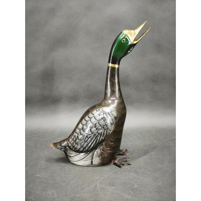 A remarkable French cast brass duck sculpture produced during the 1960s, featuring exquisite hand-painted decoration and...