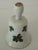 Vintage white bone china bell. The body is adorned with hand painted green holly leave and red berries. Accented with gold...