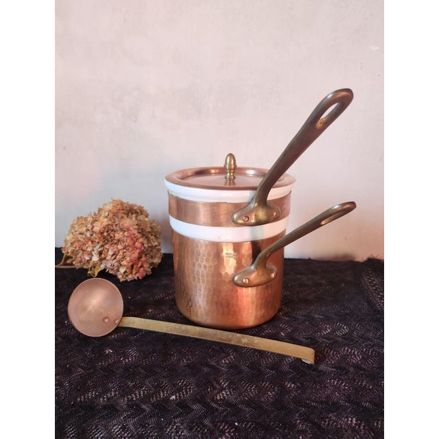 Vintage French hammered copper bain marie, double boiler, with a heavy white porcelain insert made by Apilco. The outer...