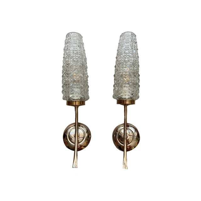 Pair of French mid-century wall lights, 1960s Featuring an iconic "tulip"silhouette, diamond-point glass and minimalist...