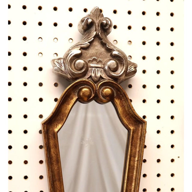 A striking pair of Hollywood Regency wall mirrors by Bassett Mirror Company, dating to the late 1970s or early 1980s. Each...