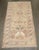 a 1940s Persian Bidjar feminine color 2 pigeon rug with green and raspberry accent colors on a neutral ground