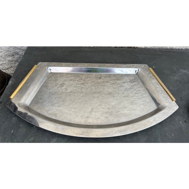 Pair of Summit 18/10 stainless steel serving trays with brass handles. The back of the trays are stamped with the...