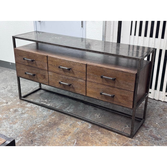 Design Plus Gallery presents a Console Table from Bassett Furniture. The console combines industrial character with...