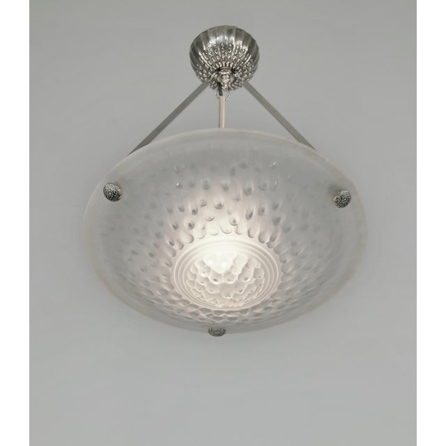 MULLER FRERES A nice French 1925 - 1935 art deco chandelier in nickel plated solid brass or bronze mount holding a bowl by...