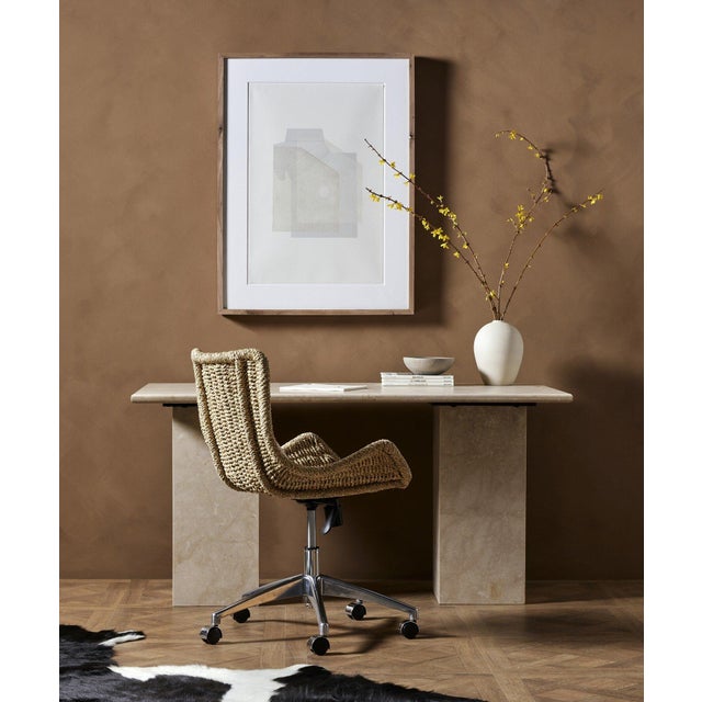 Made entirely from solid marble in a versatile creamy white, a stately, sculptural desk makes a major style statement.
