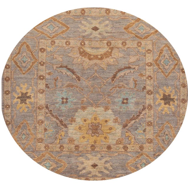 A beautiful 21st century modern square Sultanabad, hand knotted rug with a brown motif and a purple field. This collection...