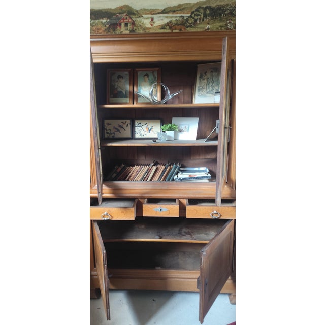 Beautiful antique French oak buffet deux corps dating from the late 19th to early 20th century, featuring a glazed upper...