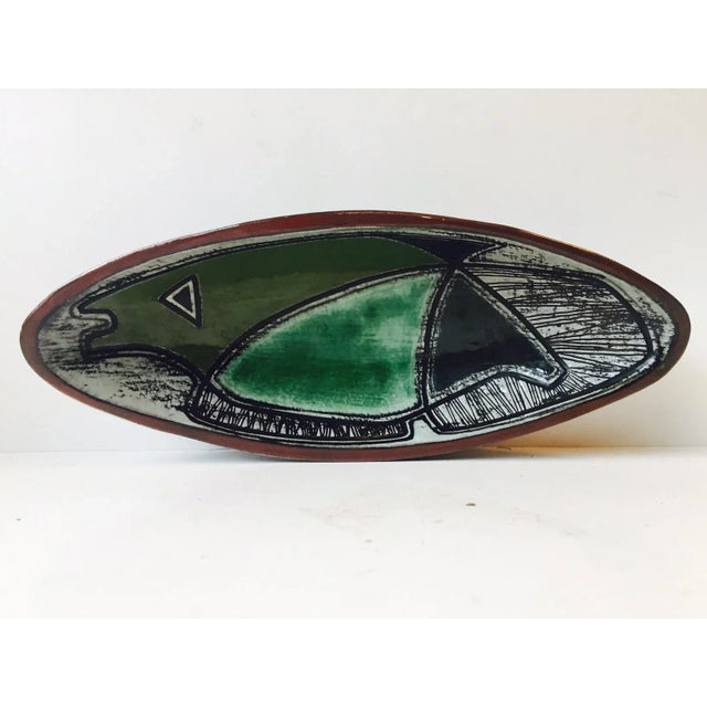 This Unika dish was decorated by Astrid Tjalk and manufactured by HAK - Kähler during the 1950s. It still has its original...