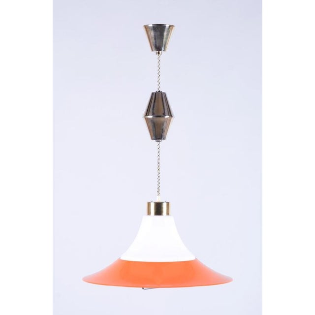 This elegant pendant chandelier originates from 1960s Czechoslovakia and is a typical representative of "Mid-Century" era...