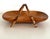 A stylish basket made of walnut with curved bamboo handles. It is a fine piece of craftsmanship; the basket is varnished...